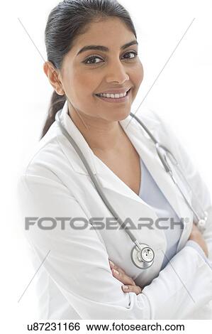 Stock Photograph - Female doctor smiling towards camera. Fotosearch