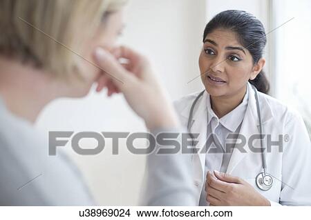 Female doctor talking to patient View Large Photo Image Picture - Female doctor talking to patient. Fotosearch
