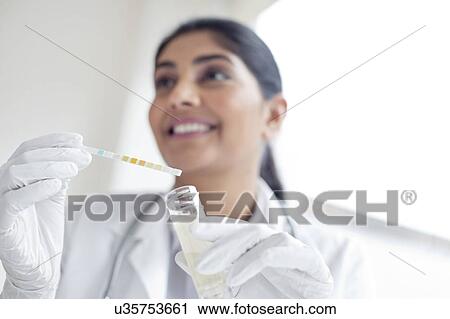 Female doctor testing urine View Large Photo Image Stock Image - Female doctor testing urine. Fotosearch