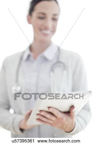 Female doctor using tablet View Large Photo Image Stock Image - Female doctor using tablet. Fotosearch