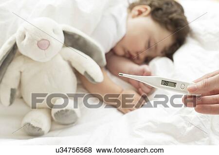 Stock Photo - Feverish baby sleeping. Fotosearch