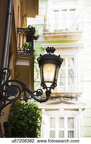Stock Image - Lantern on building. Fotosearch