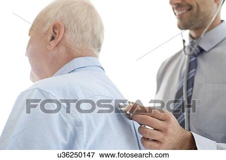 Stock Photo - Male doctor examining patient. Fotosearch