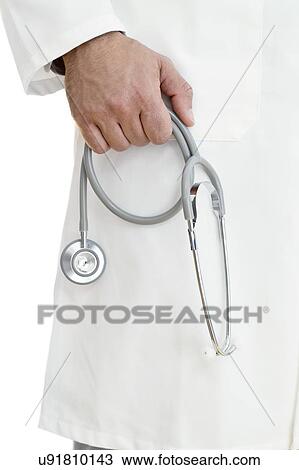Male doctor holding stethoscope View Large Photo Image Stock Image - Male doctor holding stethoscope. Fotosearch