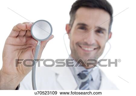 Male doctor holding stethoscope View Large Photo Image Stock Photo - Male doctor holding stethoscope. Fotosearch