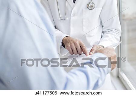 Stock Photography - Male doctor with medical. Fotosearch