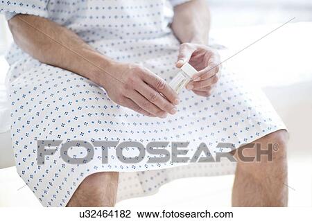 Male patient with urine sample View Large Photo Image Stock Image - Male patient with urine sample. Fotosearch