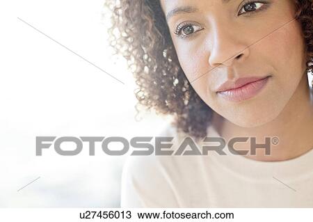 Mid adult woman looking away View Large Photo Image Stock Image - Mid adult woman looking away. Fotosearch