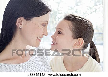 Mother and daughter face to face View Large Photo Image Stock Image - Mother and daughter face to face. Fotosearch