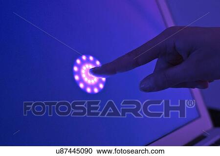 Stock Image - Person pressing button on screen. Fotosearch