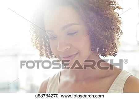Stock Image - Portrait of mid adult woman. Fotosearch