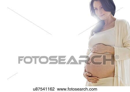 Pregnant woman touching tummy View Large Photo Image Stock Image - Pregnant woman touching tummy. Fotosearch