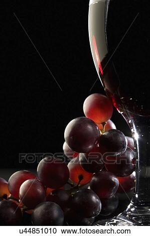 Red grapes and wine in glass, still life View Large Photo Image Stock Image - Red grapes and wine in glass, still life. Fotosearch