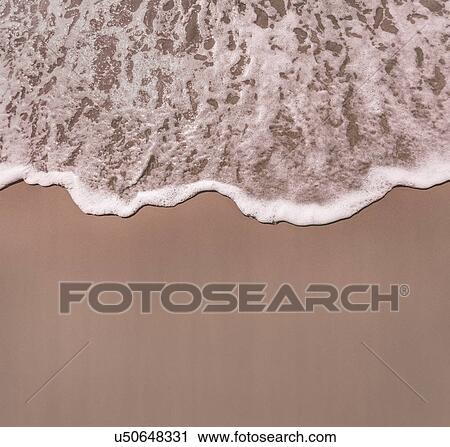 Sea surf on sand at waters edge View Large Photo Image Stock Image - Sea surf on sand at waters edge. Fotosearch