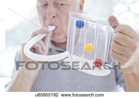 Senior using incentive spirometer View Large Photo Image Stock Image - Senior using incentive spirometer. Fotosearch