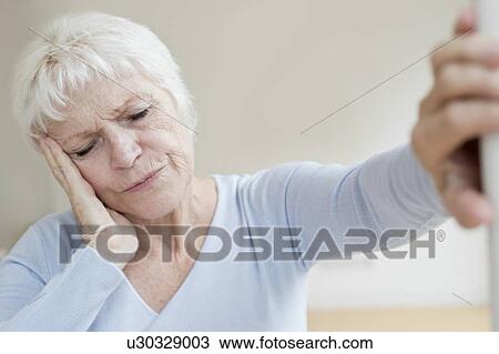 Senior woman with headache View Large Photo Image Stock Image - Senior woman with headache. Fotosearch