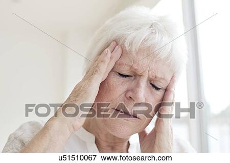 Senior woman with headache View Large Photo Image Stock Photo - Senior woman with headache. Fotosearch