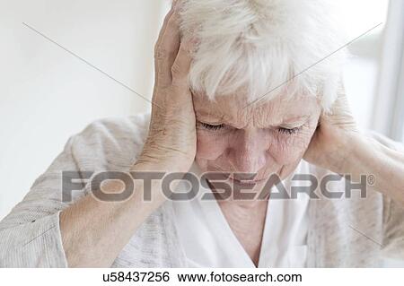 Senior woman with headache View Large Photo Image Stock Photograph - Senior woman with headache. Fotosearch