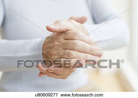 Stock Photo - Senior woman's hands, close up. Fotosearch