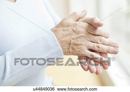Stock Photograph - Senior woman's hands, close up. Fotosearch