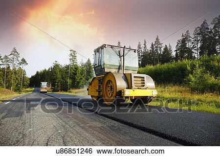 Steamrollers and asphalt View Large Photo Image Stock Photograph - Steamrollers and asphalt. Fotosearch