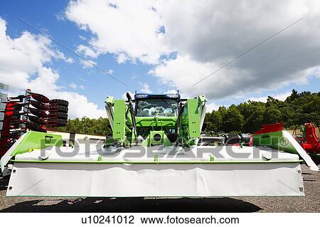 Stock Image - Tractor with mower. Fotosearch