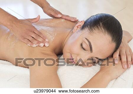 Picture - Woman having back massage. Fotosearch