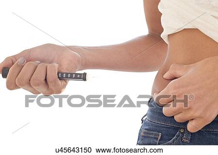 Woman injecting herself in tummy View Large Photo Image Stock Image - Woman injecting herself in tummy. Fotosearch