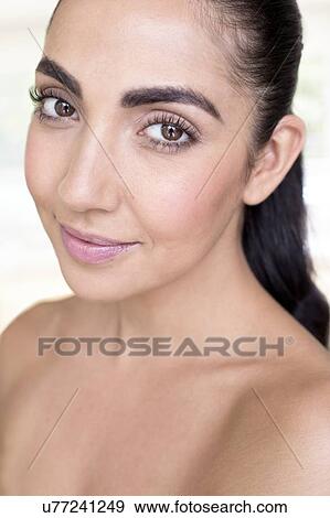 Stock Photo - Woman looking at camera. Fotosearch