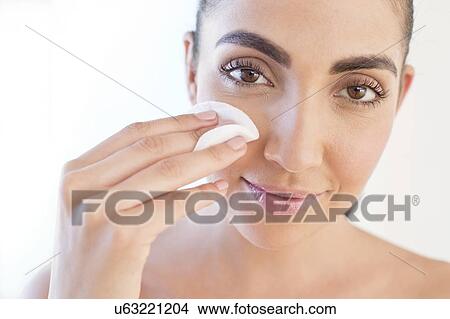 Woman removing make up View Large Photo Image Picture - Woman removing make up. Fotosearch