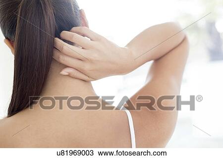 Woman scratching neck View Large Photo Image Stock Image - Woman scratching neck. Fotosearch