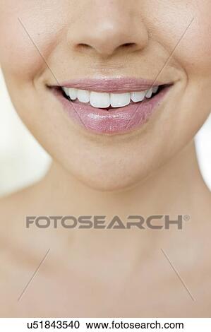 Stock Image - Woman smiling, close up. Fotosearch