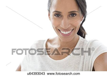 Stock Image - Woman smiling towards camera. Fotosearch