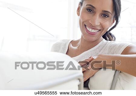 Woman smiling towards camera View Large Photo Image Stock Photography - Woman smiling towards camera. Fotosearch