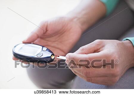 Woman testing blood sample View Large Photo Image Stock Image - Woman testing blood sample. Fotosearch