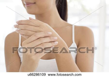 Stock Photo - Woman touching hand. Fotosearch
