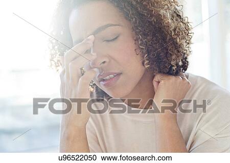 Woman touching her face View Large Photo Image Stock Image - Woman touching her face. Fotosearch
