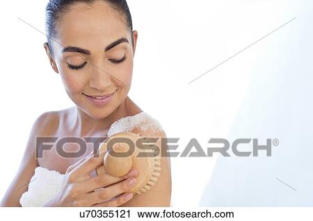 Woman using body brush on shoulder View Large Photo Image Stock Image - Woman using body brush on shoulder. Fotosearch