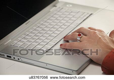 Stock Photograph - Woman using laptop. Fotosearch