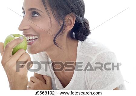 Stock Image - Woman with apple. Fotosearch