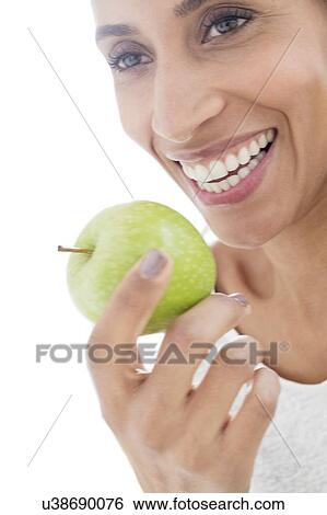 Woman with apple View Large Photo Image Stock Photograph - Woman with apple. Fotosearch