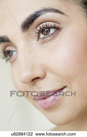 Stock Image - Woman with brown eyes. Fotosearch