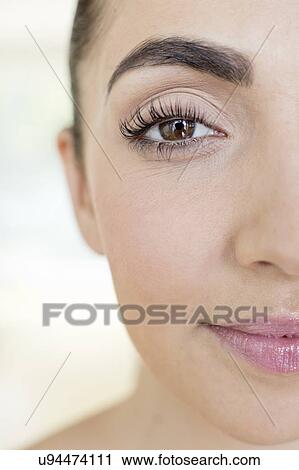 Stock Image - Woman with brown eyes. Fotosearch