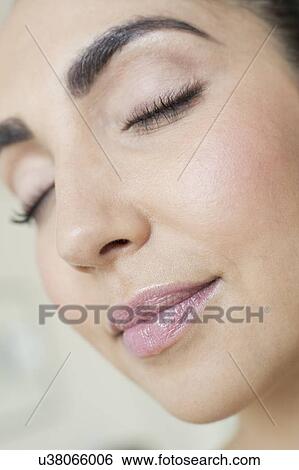 Woman with eyes closed View Large Photo Image Stock Photograph - Woman with eyes closed. Fotosearch