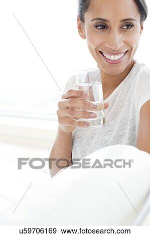 Stock Photo - Woman with glass of water. Fotosearch