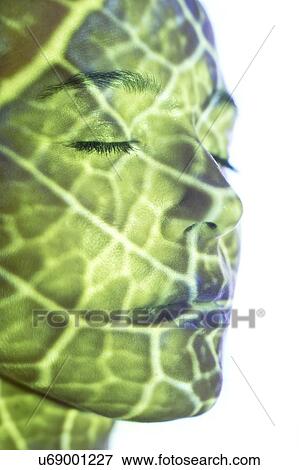 Woman with green pattern projected on face View Large Photo Image Stock Photo - Woman with green pattern projected on face. Fotosearch