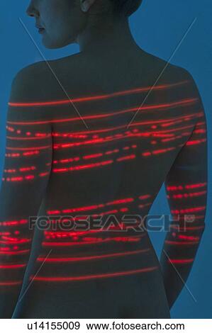 Woman with red lights on back View Large Photo Image Stock Photo - Woman with red lights on back. Fotosearch
