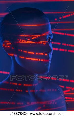 Picture - Woman with red lights on face. Fotosearch