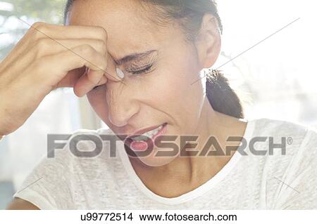 Woman with tension headache View Large Photo Image Picture - Woman with tension headache. Fotosearch