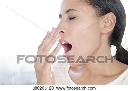 Woman yawning, eyes closed View Large Photo Image Stock Image - Woman yawning, eyes closed. Fotosearch